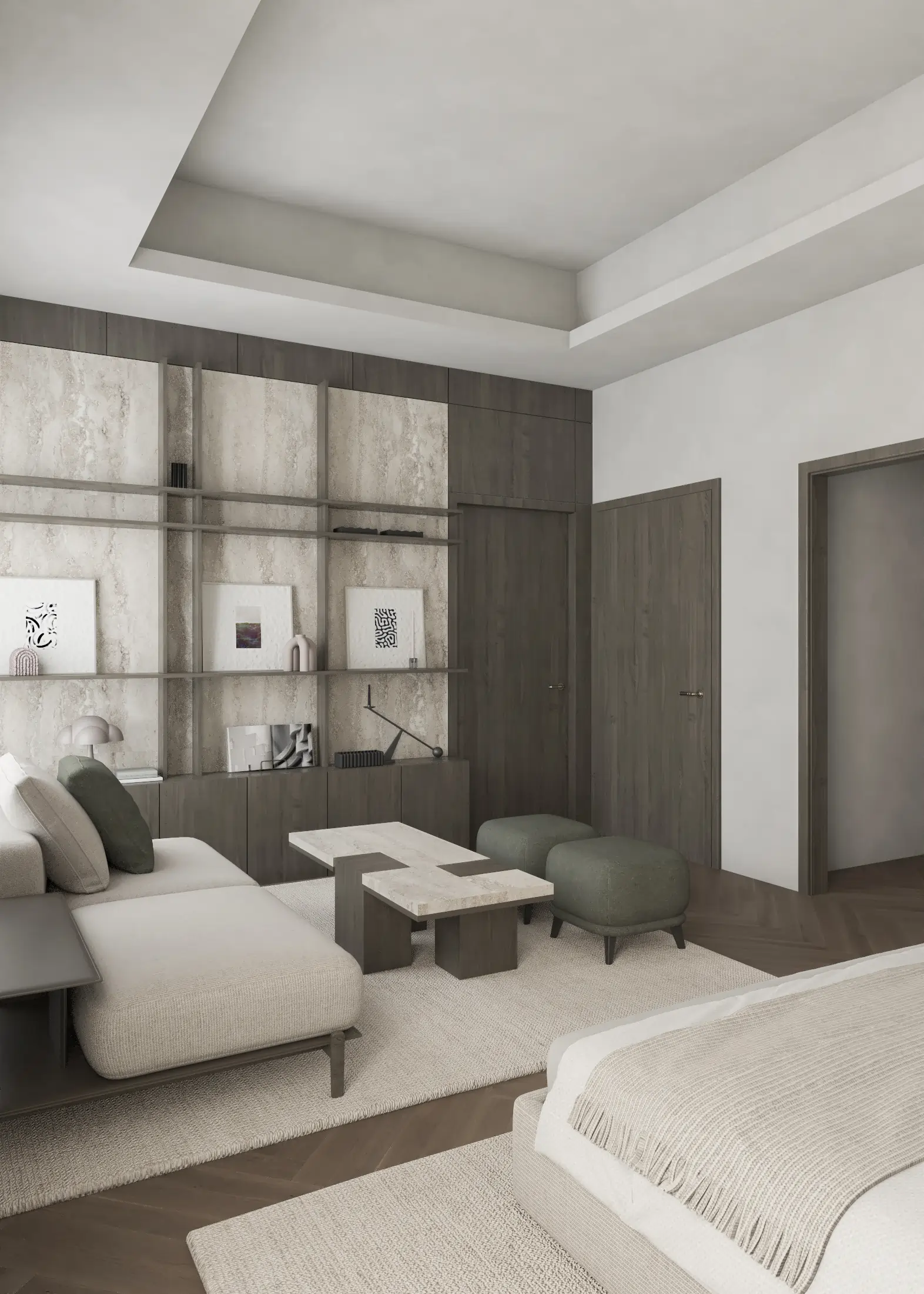 Bedroom sitting area with low tables, two armchairs and illuminated open shelving.