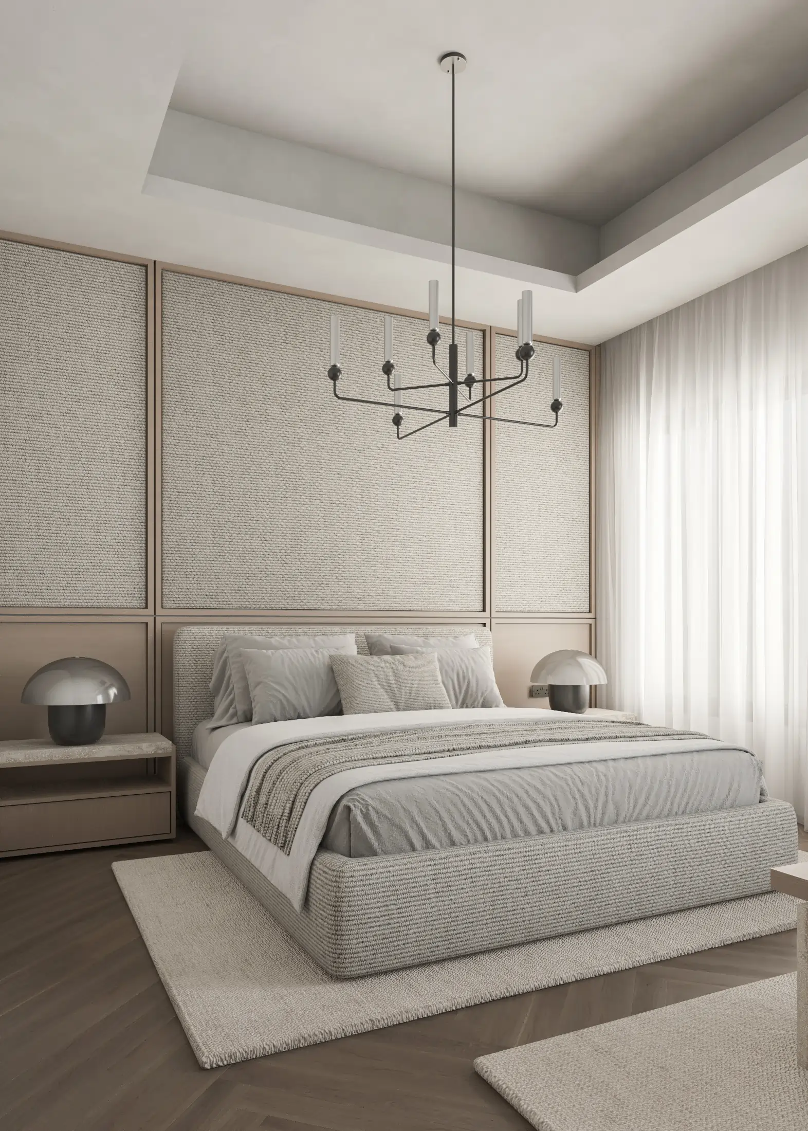Angled view of the upholstered bed, textured headboard panels and full-height curtains.