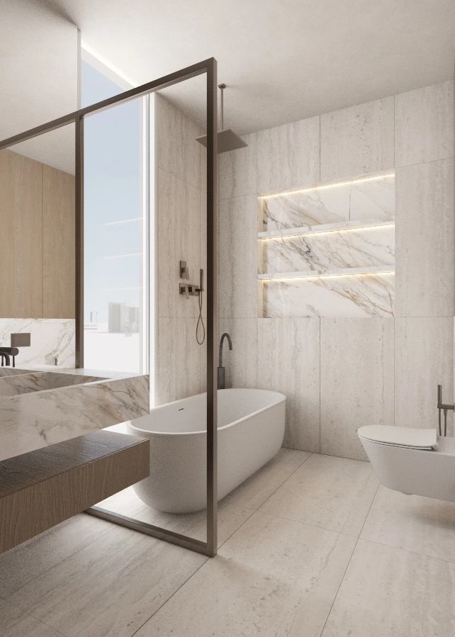 Freestanding bath beside a glazed shower screen and wall-mounted toilet