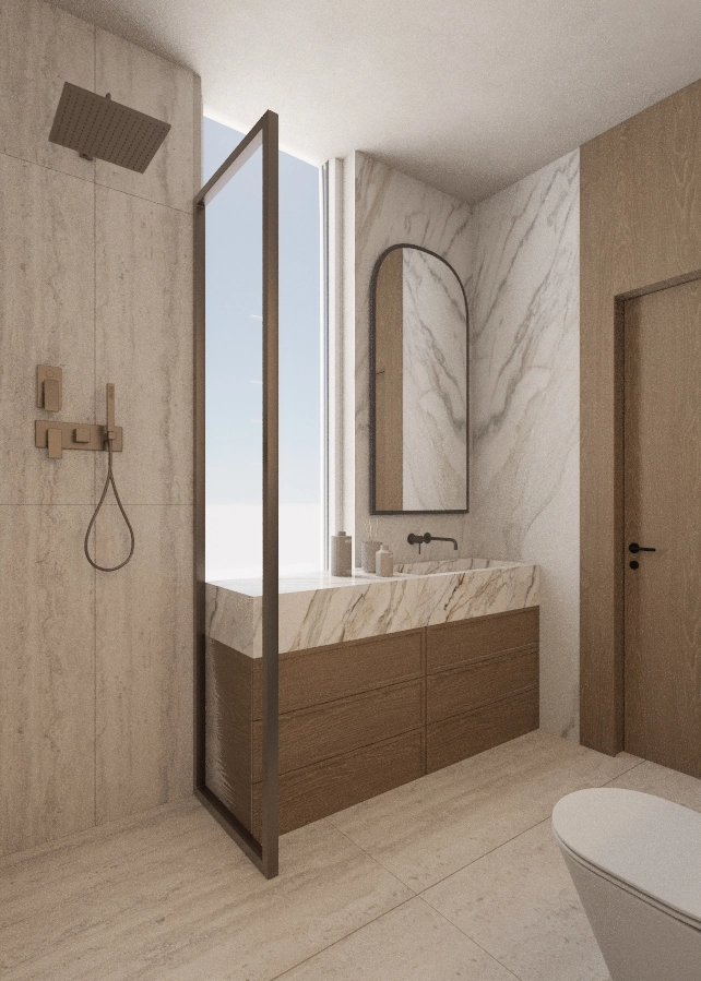 Walk-in shower screen framing a timber vanity, marble counter and arched mirror