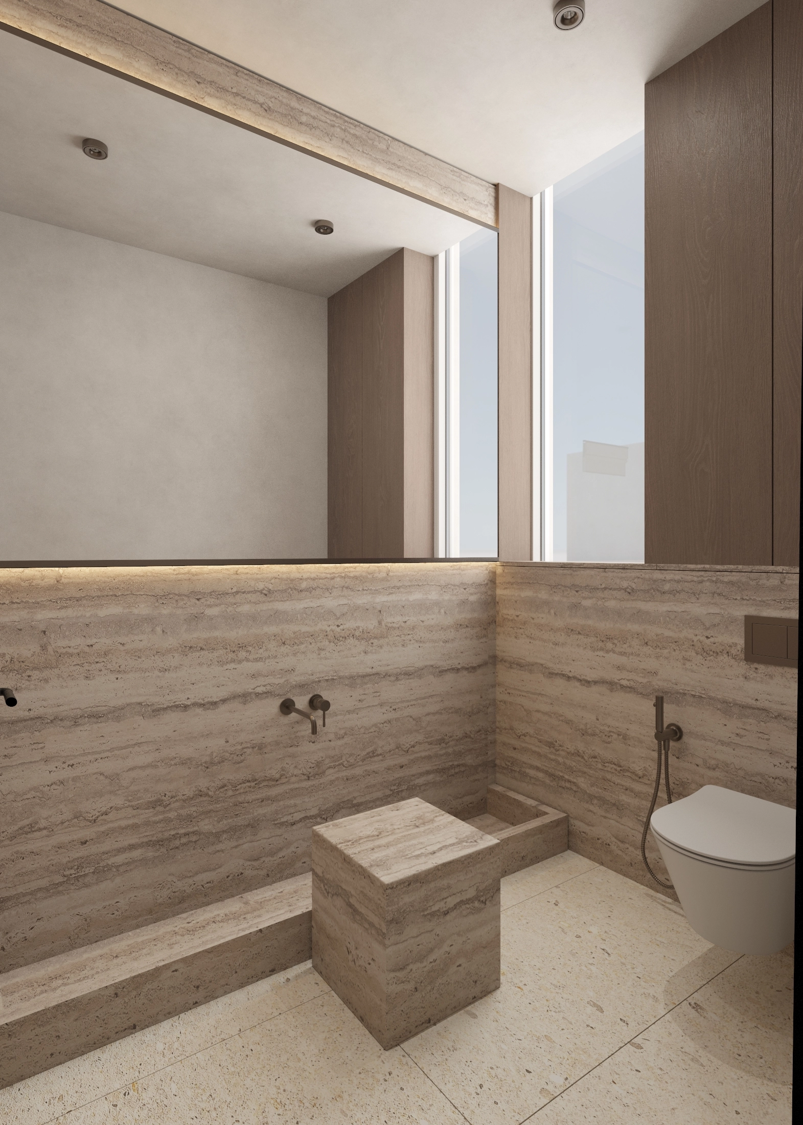 Built-in stone bath beneath a broad mirror with wall-mounted tapware