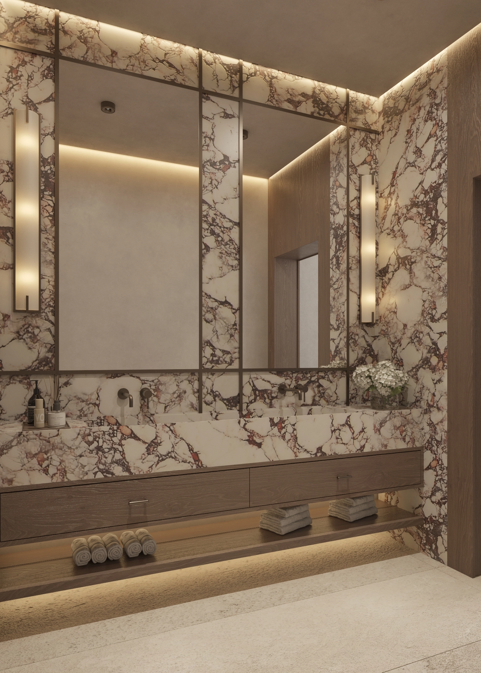 Mirrored marble feature wall with warm perimeter lighting and open towel shelf