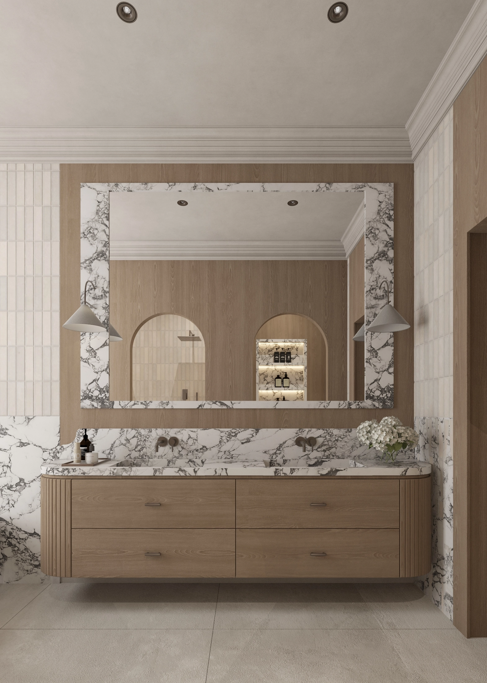 Front view of a timber vanity beneath a large marble-framed mirror