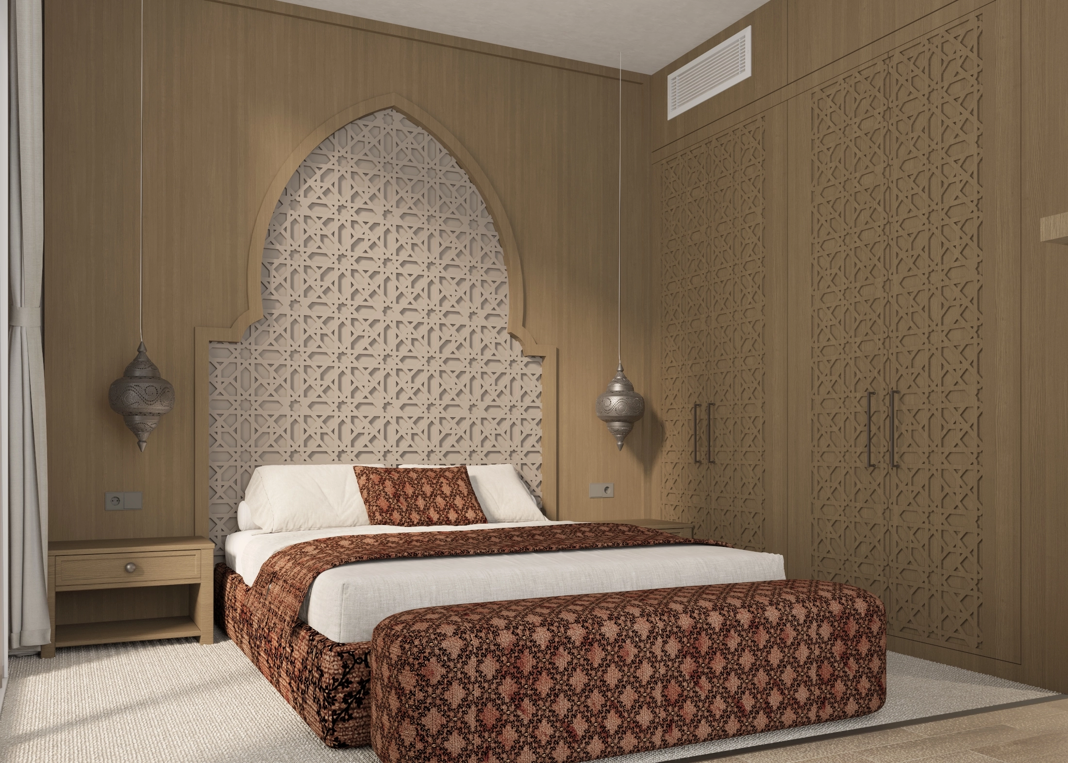 Angled main bedroom view with an arched patterned headboard, built-in wardrobes and pendant lights