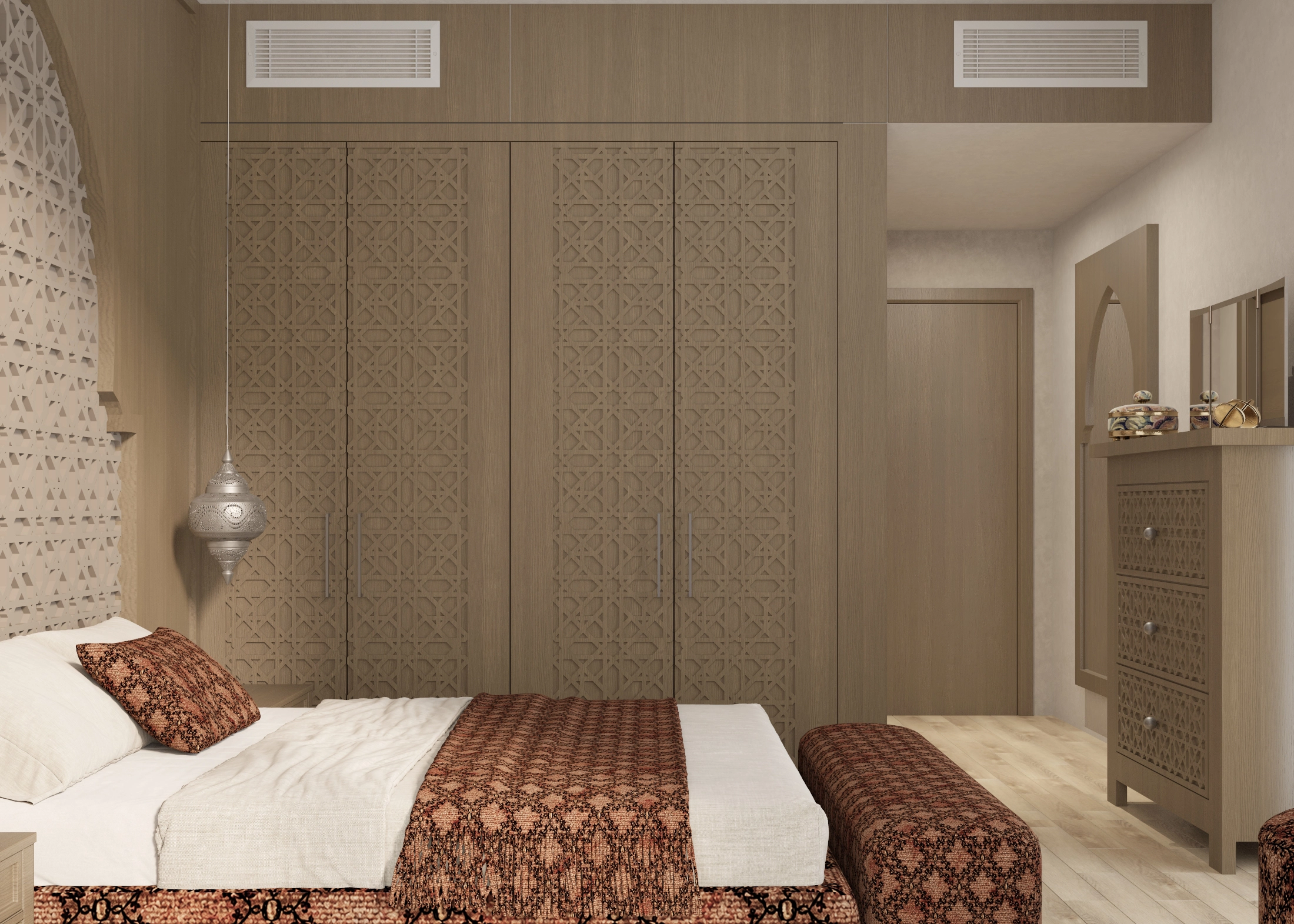 Main bedroom view toward a patterned wardrobe with the upholstered bed in the foreground