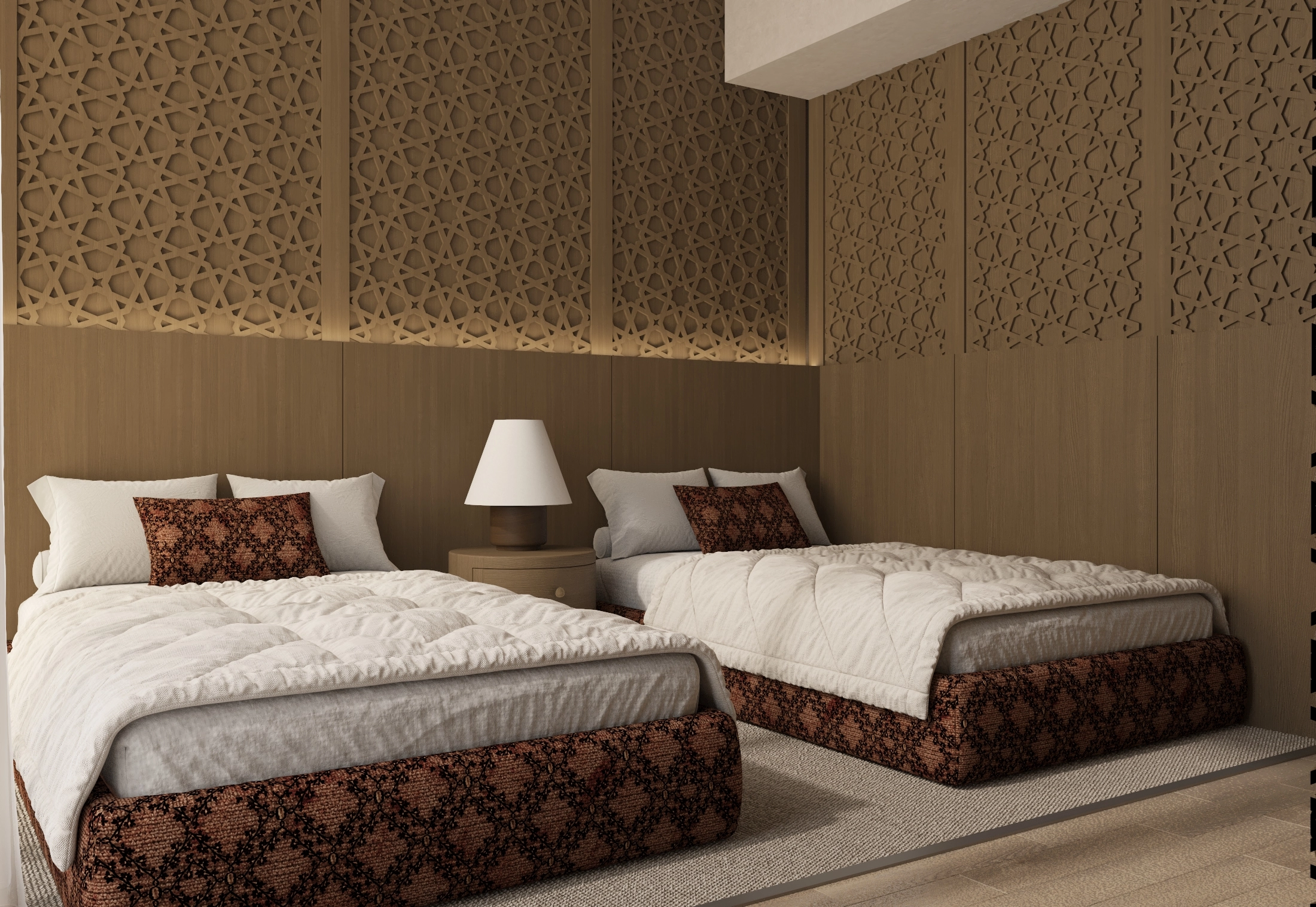 Angled view of twin beds with rust-patterned bases, a lattice feature wall and bedside lamp