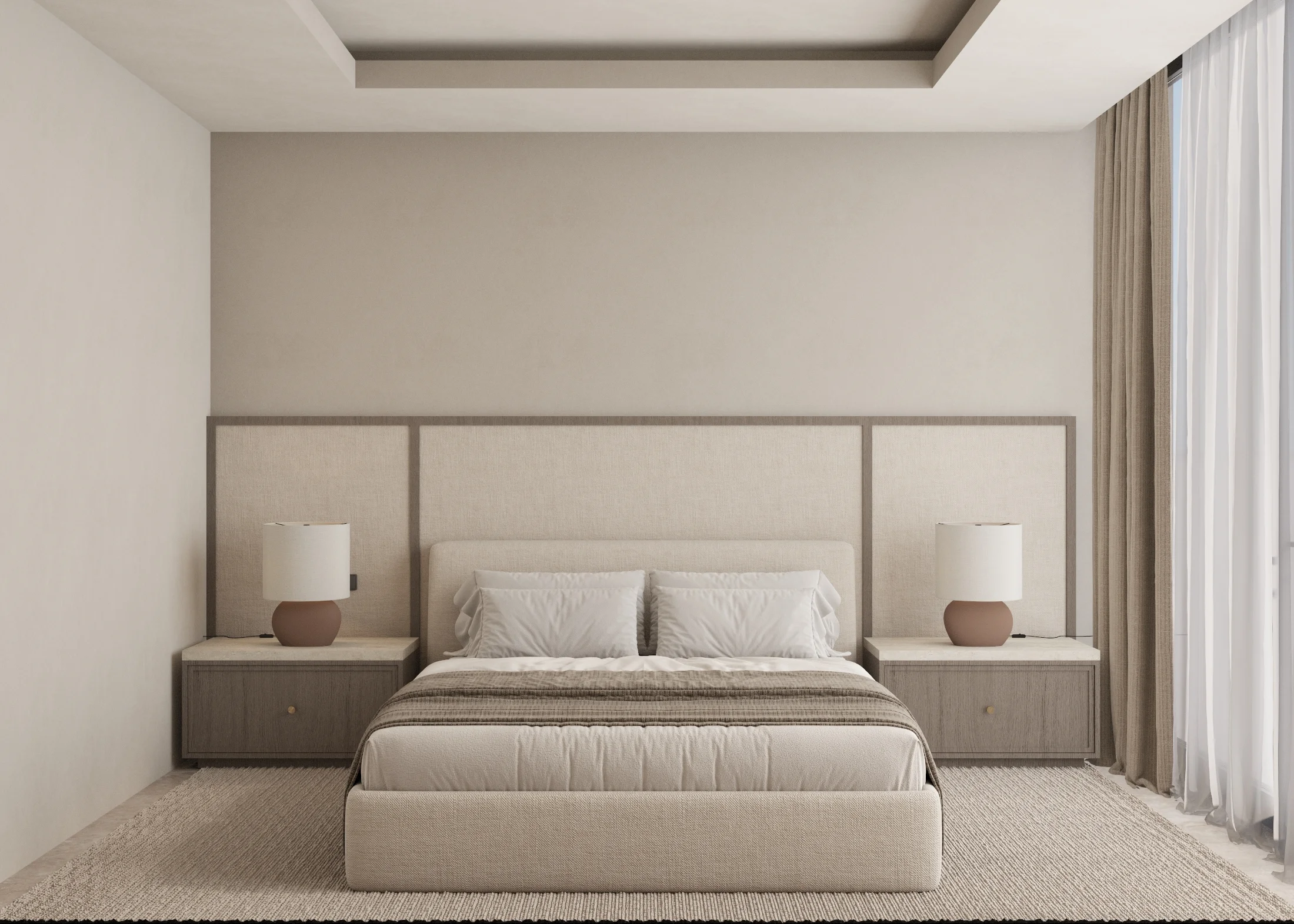 Serene bedroom with an upholstered headboard wall, integrated bedside tables and floor-to-ceiling drapery