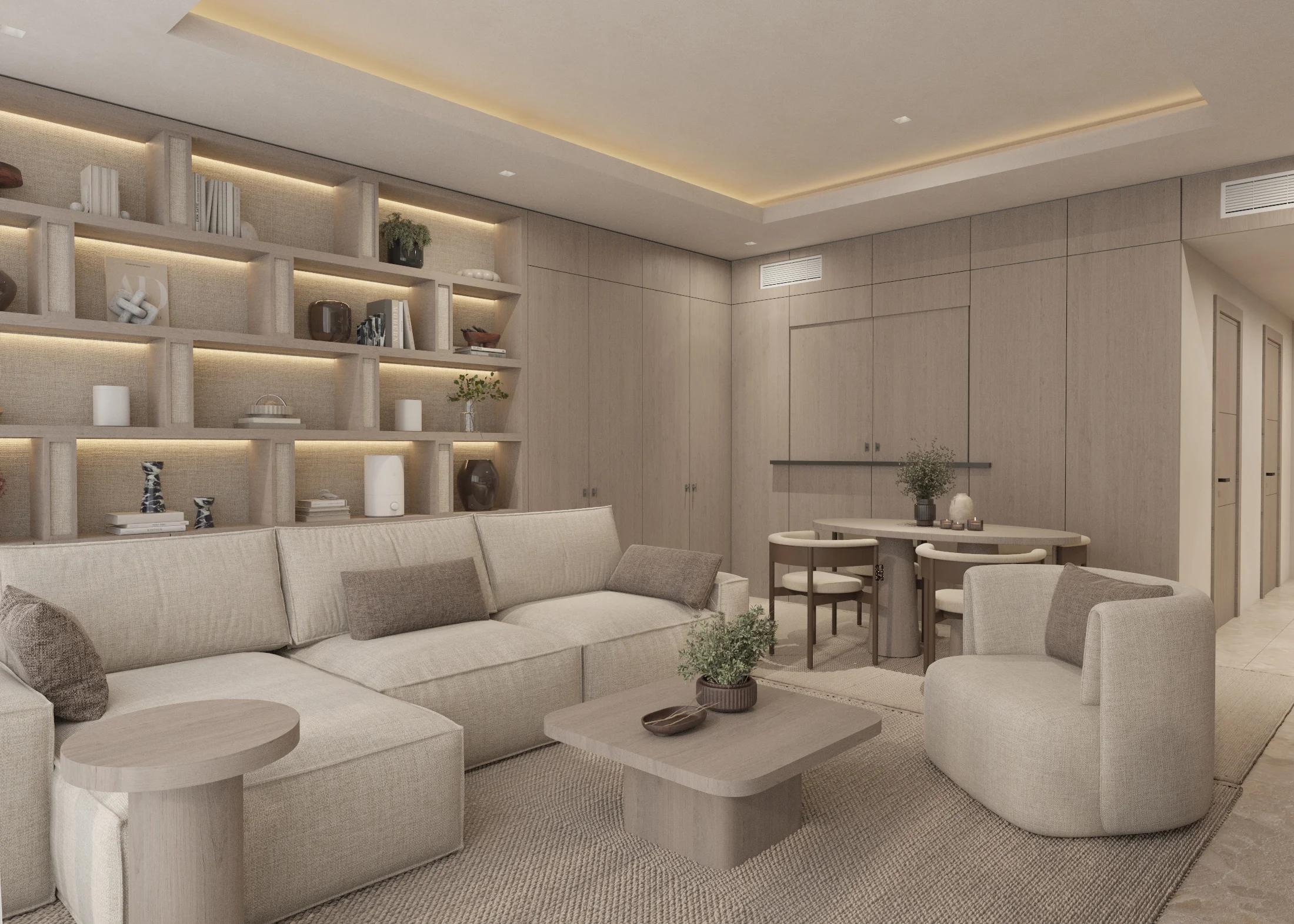Warm neutral living and dining area with soft-edged seating and a clear hallway connection