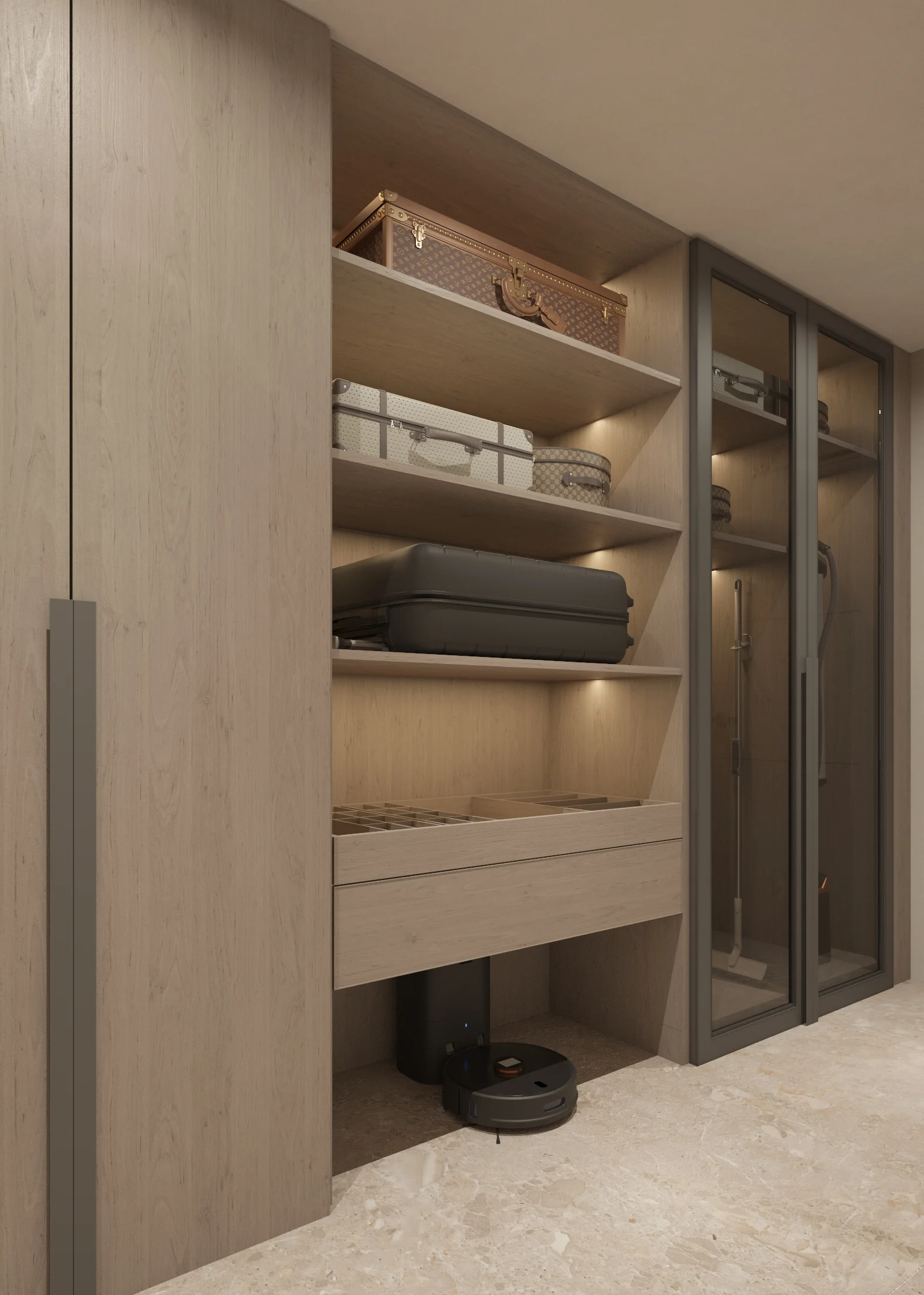 Close angled view of luggage shelves, a compartmented wardrobe drawer and glass-fronted tall storage