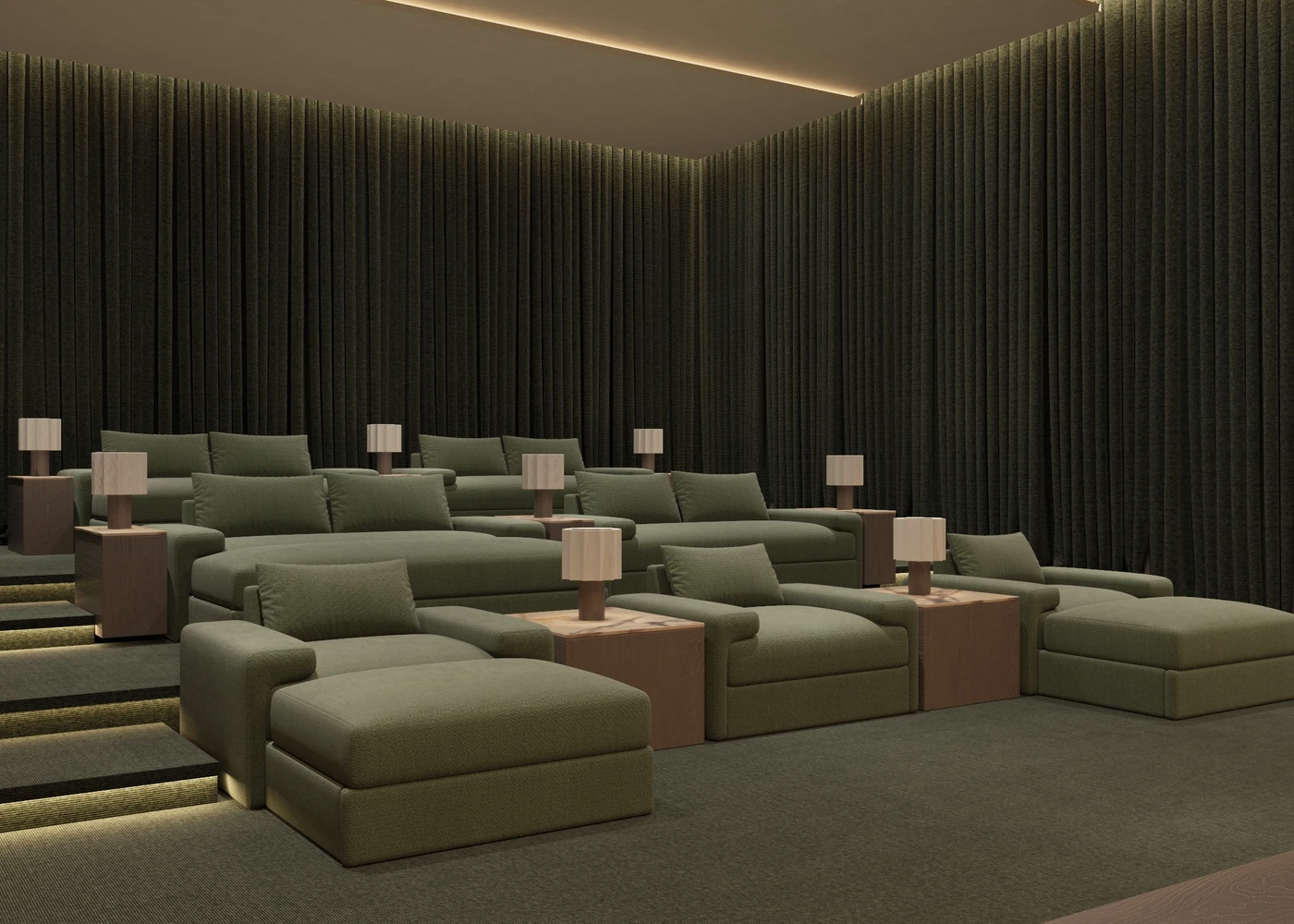 Angled view across green cinema seating beneath dark acoustic curtains
