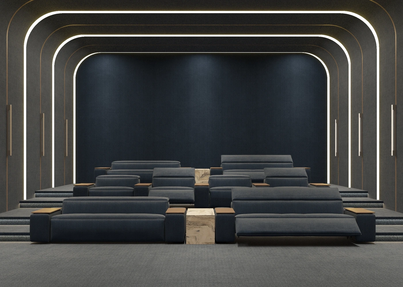 Front view of tiered blue cinema seating beneath illuminated arch frames