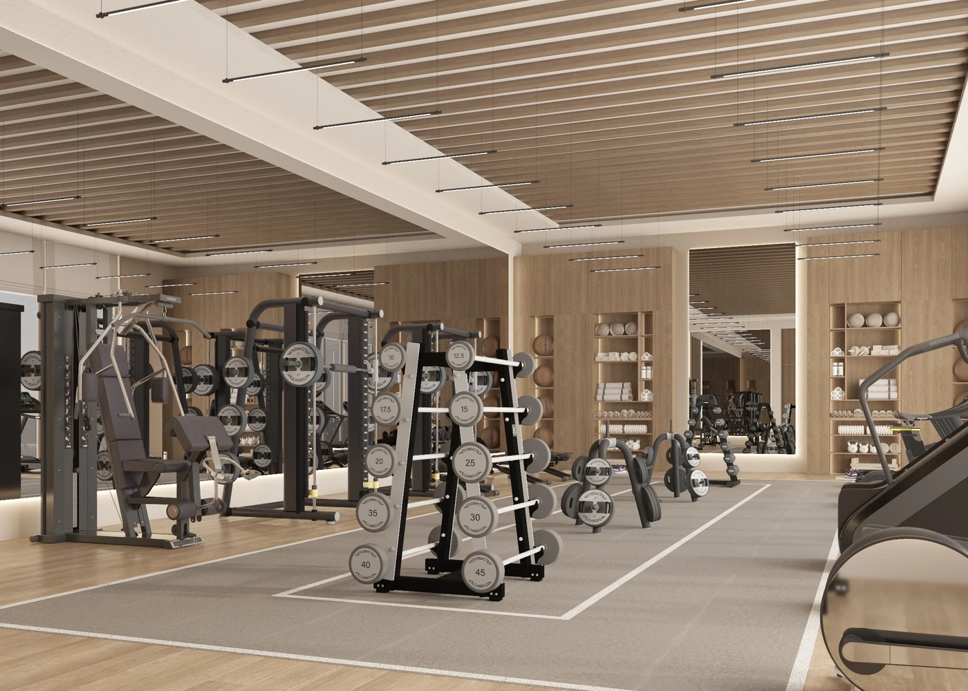Angled gym view across free weights toward timber display joinery