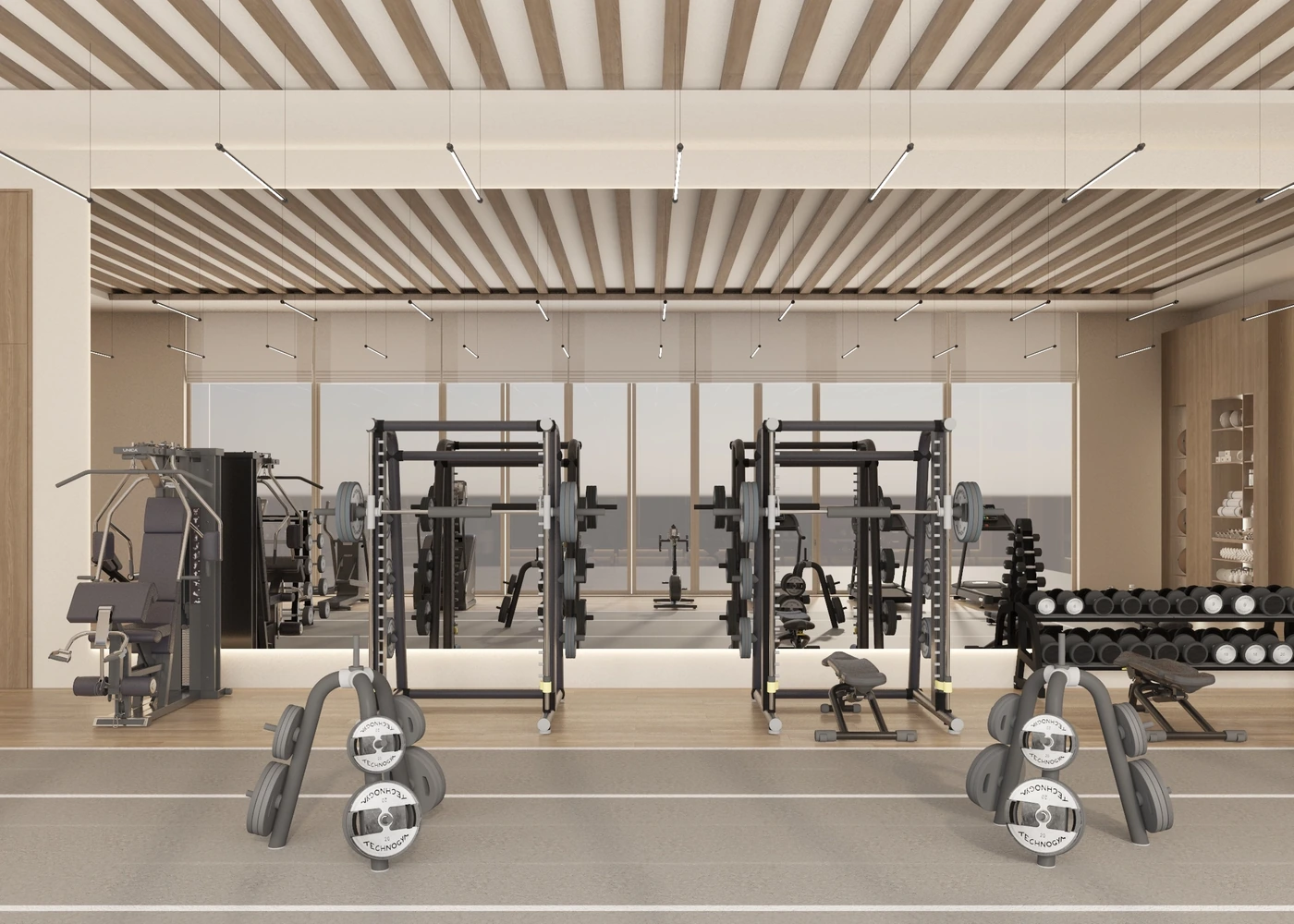 Mirrored gym wall reflecting benches, weight racks and training machines