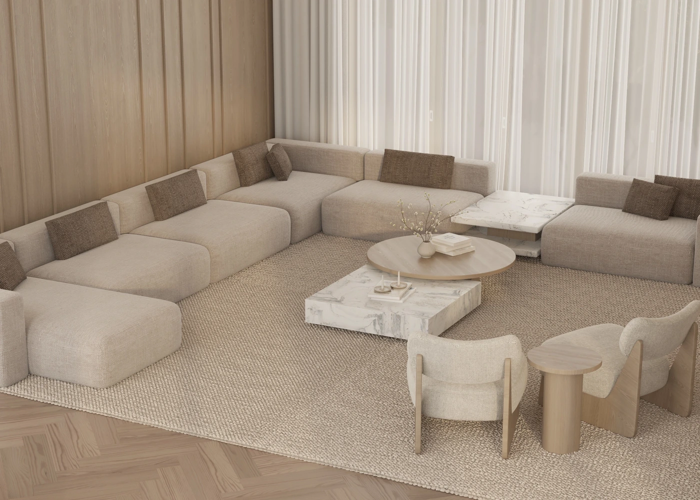 Overhead view of a pale sectional, marble tables and two curved lounge chairs