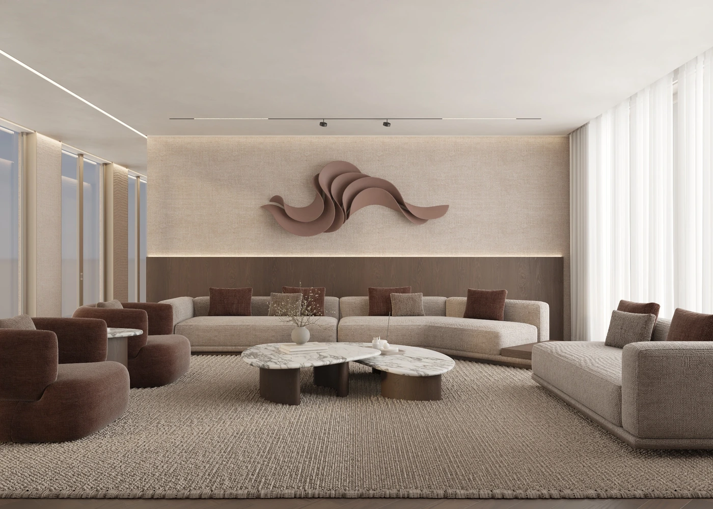 Front view of curved sofas beneath a terracotta sculptural wall artwork