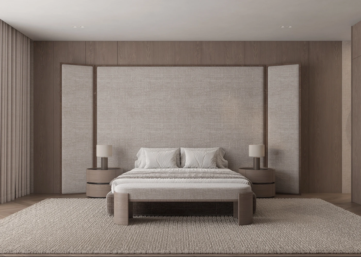 Front view of the master bed against a broad upholstered panel and timber wall