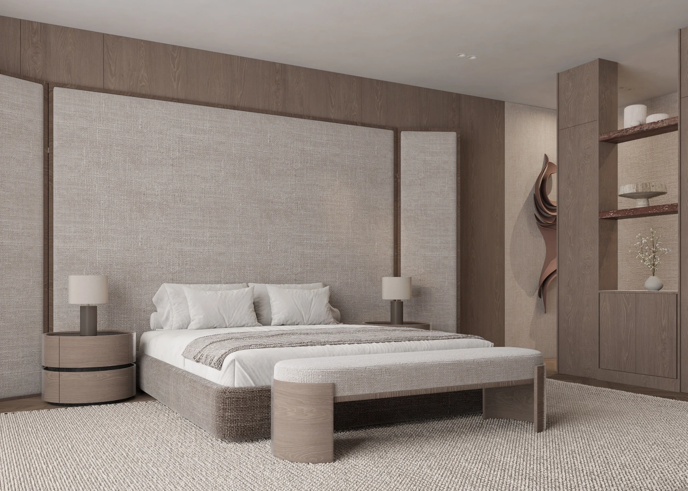 Angled master-bedroom view with upholstered bed, bench and curved bedside tables